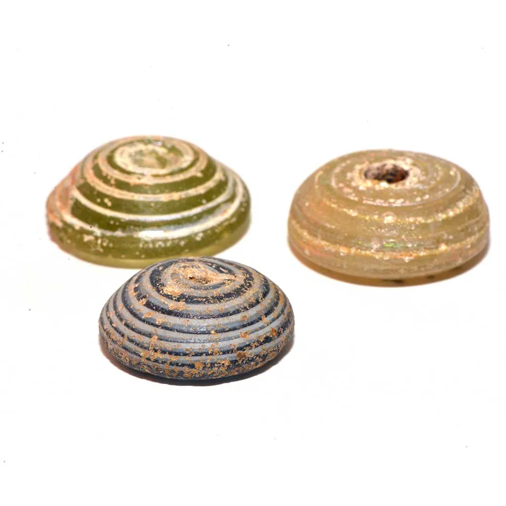 A set of three Roman Glass Spindle Whorls, Roman Imperial Period, ca. 3rd Century CE