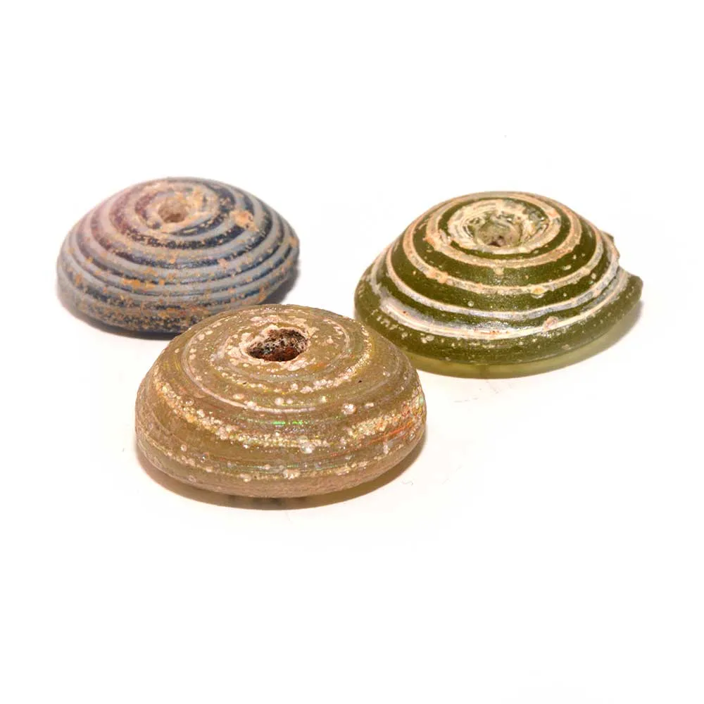 A set of three Roman Glass Spindle Whorls, Roman Imperial Period, ca. 3rd Century CE